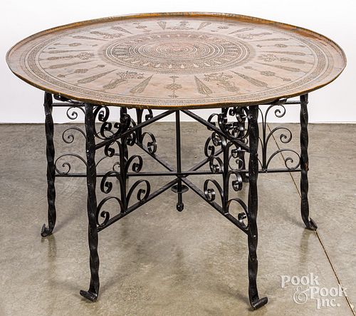 Wrought iron center table with embossed brass top