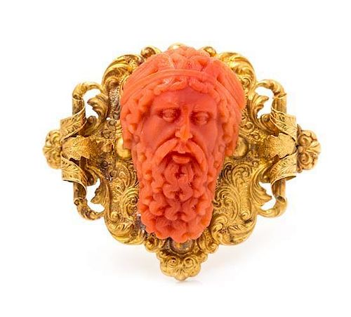 A Victorian Yellow Gold and Carved Coral Cameo Brooch, 7.00 dwts.