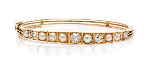 A Yellow Gold, Diamond and Pearl Bangle Bracelet, 9.30 dwts.