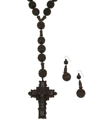A carved wood rosary necklace and matching earrings