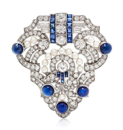 * An Art Deco Platinum, Diamond, Seed Pearl and Sapphire Brooch, 12.75 dwts.