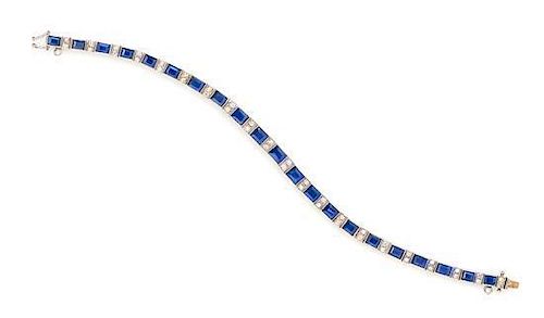 A White Gold, Sapphire and Diamond Line Bracelet, 10.90 dwts.