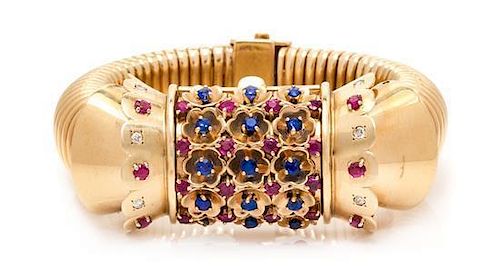 A Retro Rose Gold, Ruby, Sapphire and Diamond Surprise Wristwatch, John Rubel for Cartier, 71.60 dwts.