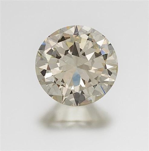 * An 11.90 Carat Round Brilliant Cut Diamond, 6.60 dwts.
