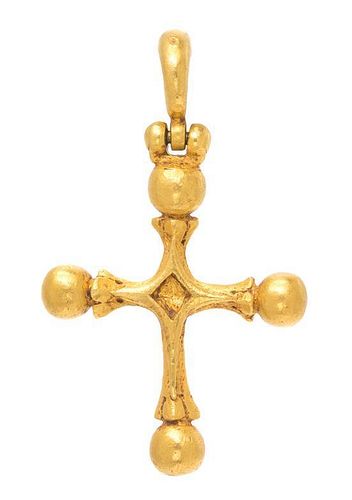 * A Sculpted Gold Cross Pendant, 16.90 dwts.