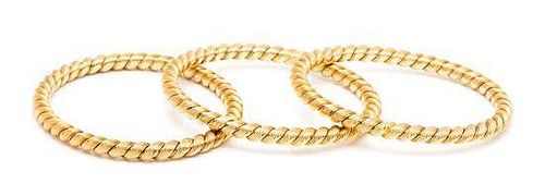 A Trio of 18 Karat Gold Yellow Gold Bangle Bracelets, Van Cleef & Arpels, France, 50.40 dwts.