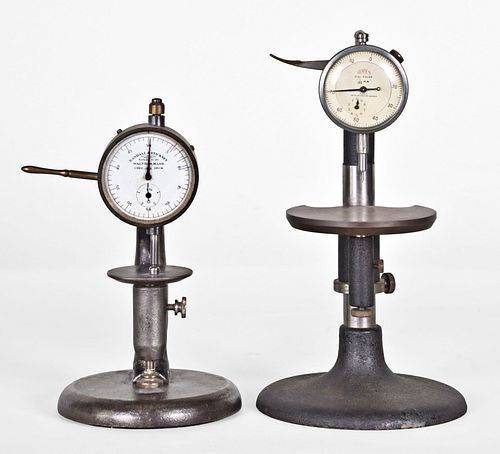 A lot of two thickness gauges on cast iron bases