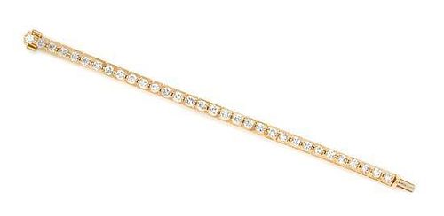 A Yellow Gold and Diamond Line Bracelet, 21.80 dwts.