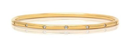 * An 18 Karat Yellow Gold and Diamond Bangle Bracelet, Tiffany & Co., 11.80 dwts.