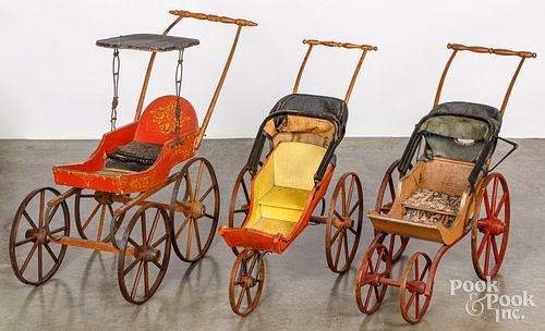 Three painted and stenciled child's doll strollers