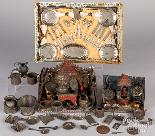 Two German doll size tin toy kitchens, 19th c.