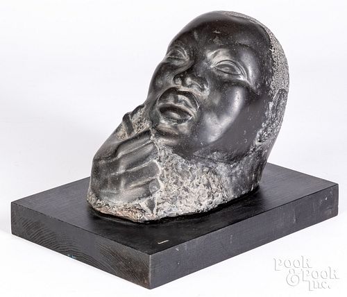 Carved stone head of an African