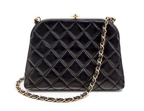 * A Chanel Black Quilted Hardsided Handbag, 8.5" x 6.5" x 2".