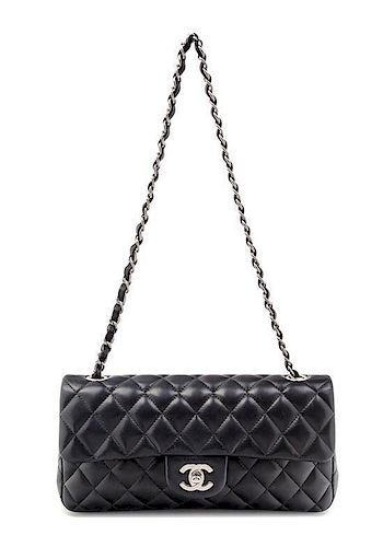 * A Chanel Black Quilted Single Flap Handbag, 10" x 5.5" x 1.5".