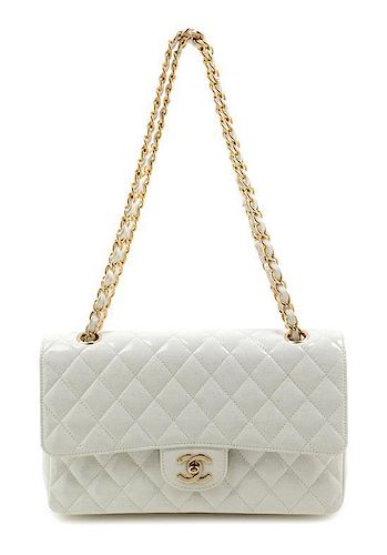* A Chanel White Patent Quilted Double Flap Handbag, 10" x 6" x 2".