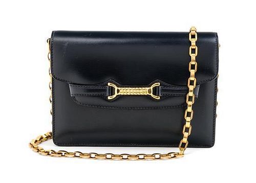 * A Gucci Navy Handbag, 7.5" x 5.5" x 1.5"