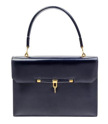 * An Hermes Navy Leather Handbag, 10 1/2" x 7 1/2" x 2".