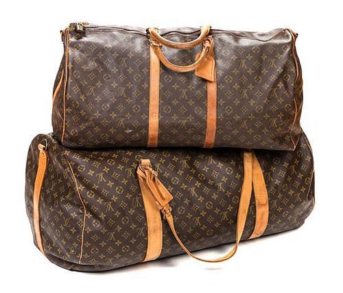 A Pair of Louis Vuitton Duffle Bags, 24" x 12" x 10.5"