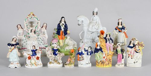A Large Group of Staffordshire Pottery Figures