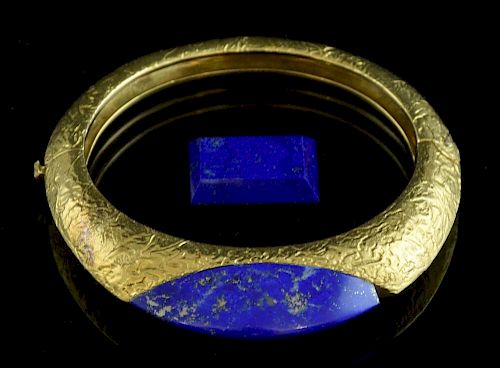 Lapis and gold bangle by Kutchinsky, 1970's  polished lapis to the centre on a 18 ct gold hinged bangle with a textured finis