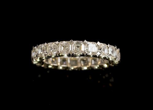 Diamond full eternity ring set with twenty Asscher cut diamonds mounted in white metal tested as platinum. Estimated total di