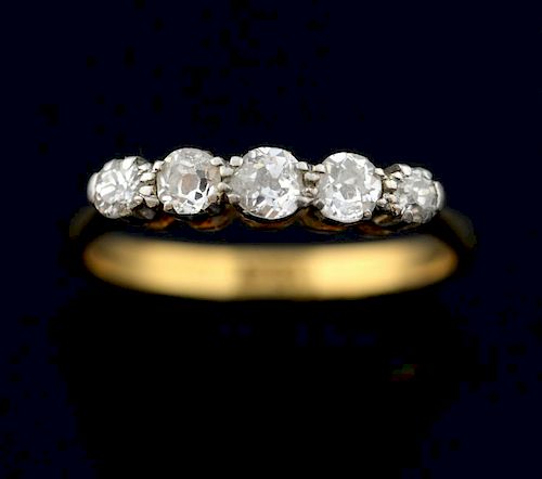 Five stone diamond ring, set with old cut diamonds in a claw setting, mounted in 18ct yellow gold. Estimated total diamond we