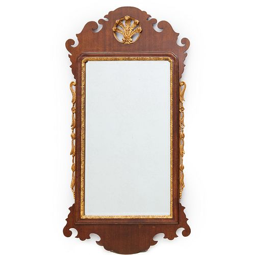 Chippendale style carved and parcel gilt mirror