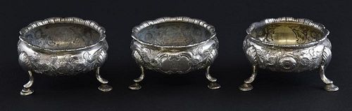 Matched set of three George III silver salts, with embossed decoration on three hoof feet, two by David Mowden, London, 1763,