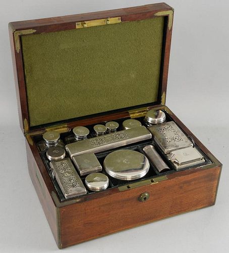 William IV/Victorian mahogany and brass bound gentleman's dressing case with silver topped and cut glass jars, boxes, inkwell