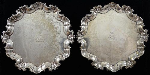 Pair of George III Irish silver card trays with moulded serpentine rims on three scroll feet, maker's mark rubbed, Dublin, no