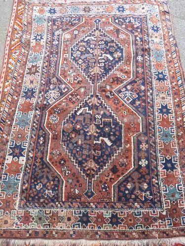 Persian blue ground rug multiple boarders centre with two stepped lozenge shaped medallions 68cm x 111cm