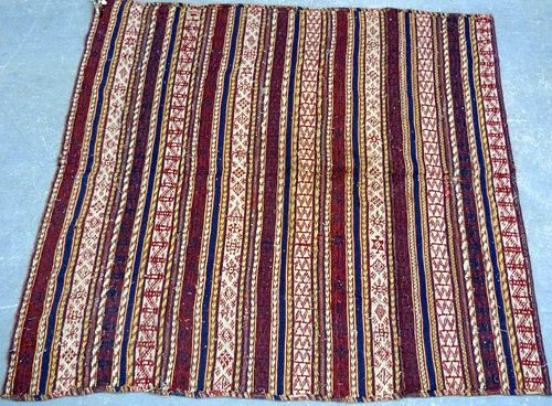 Persian design rug and a woven wall hanging,