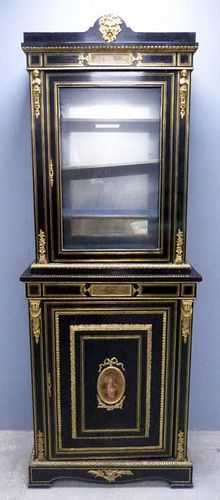 19th century ebonised cabinet, glazed door over cupboard door, gilt metal mounts, inset with painted panels,
