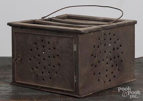 Pine and punched tin footwarmer, 19th c., 7 1/2'' x 11 3/4''.