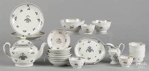 English porcelain tea service, early 19th c., with grisaille floral decoration, twenty-five pieces.
