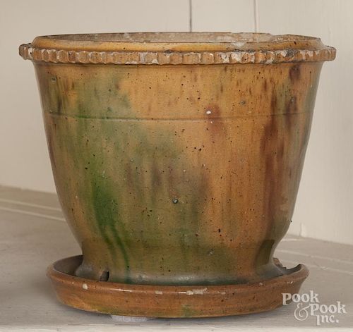 Pennsylvania redware flower pot, 19th c., with an attached undertray, 5 3/4'' h.