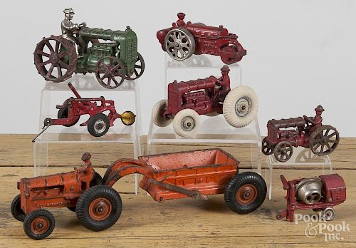 Seven cast iron farm tractors, etc., to include Arcade, Kenton, and Hubley