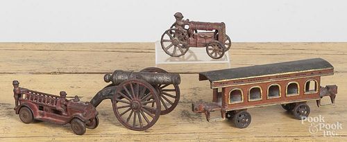 Four cast iron toys, to include a New York Central & Hudson River passenger car, 8 3/4'' l.
