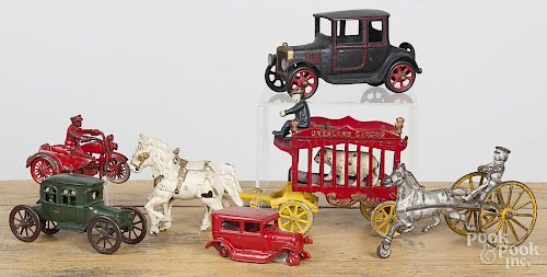 Cast iron toys, to include a Kenton Overland Circus horse drawn cage wagon, 14'' l.