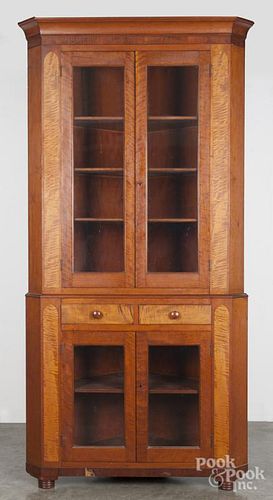 Pennsylvania cherry and tiger maple two-part corner cupboard, ca. 1835, 94 1/2'' h., 44'' w.