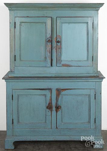 Painted pine two-part cupboard, ca. 1800, retaining a later blue surface, 74 1/2'' h., 49'' w.
