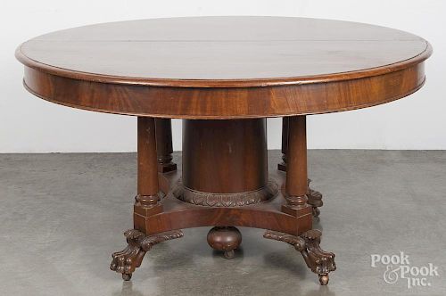 Empire mahogany extension dining table, 19th c., 29'' h., 53 1/2'' w., together with four 13'' leaves.