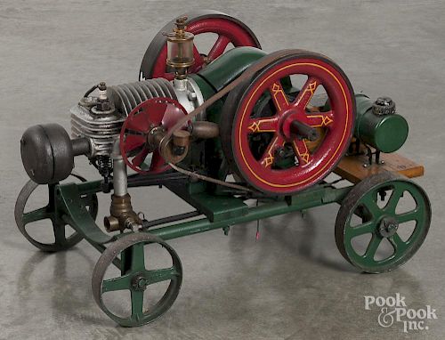 Ideal one HP hit and miss engine, ca. 1900, with cast iron wheeled base, 32'' l., 18'' w.