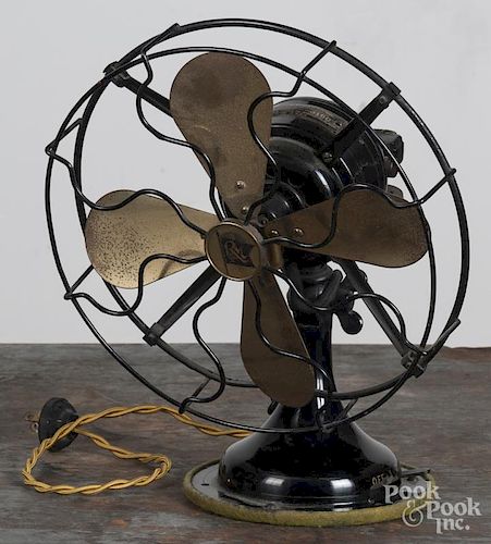 Cast iron and brass fan, early 20th c., 12'' h., together with three water sprinklers.