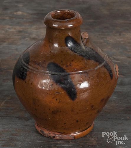 Miniature redware jug, 19th c., with manganese splotches, 3 1/2'' h. Provenance: Titus Geesey.