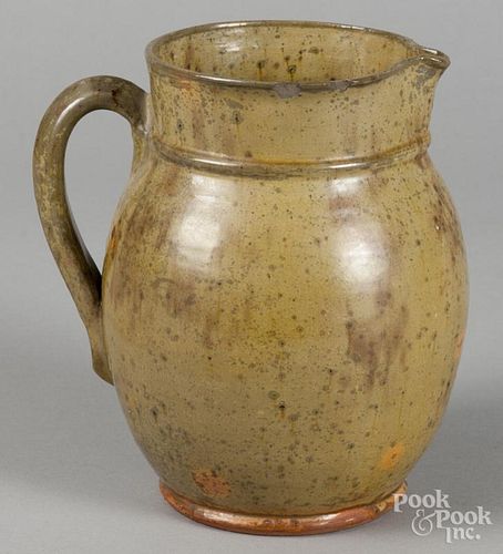 New England redware pitcher, 19th c., 7 1/2'' h. Provenance: Titus Geesey.