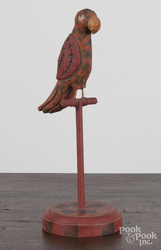 Carved and painted parrot on a perch, 12 1/4'' h.