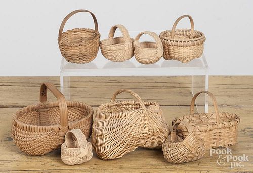 Nine miniature baskets, to include examples by Trevle Wood, Arawjo, etc., largest - 3 1/2'' h., 4'' w.