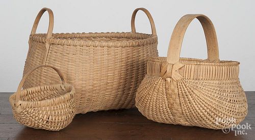 Three modern baskets, the largest signed Niehues, 9'' x 11''.