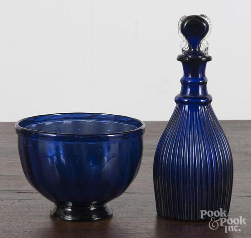 Blown cobalt glass bowl, 3 1/2'' h., 4 5/8'' dia., together with a cruet, 7 1/4'' h.